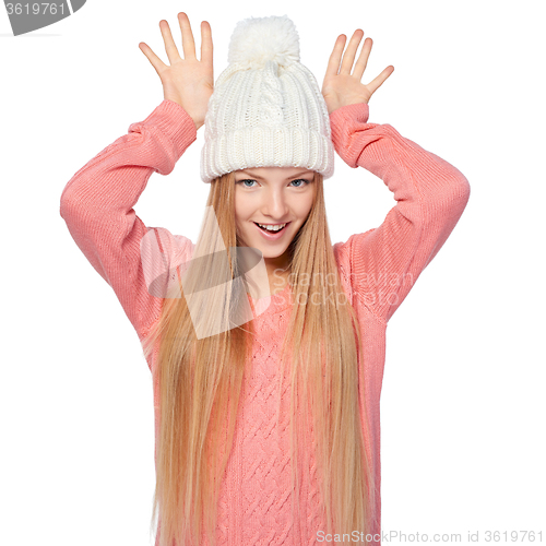 Image of Girl gesturing imitating deer antlers