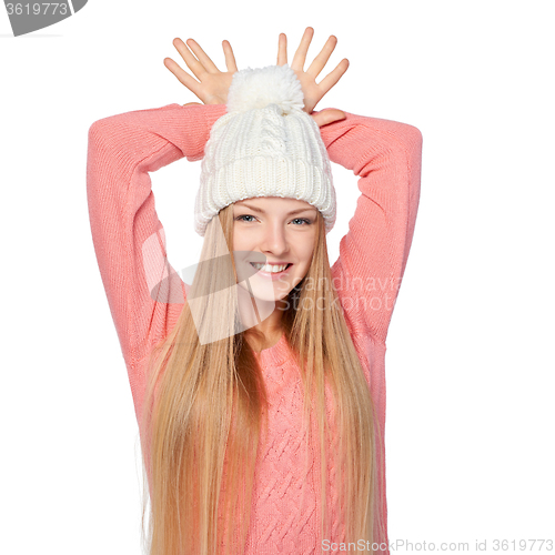 Image of Girl gesturing imitating deer antlers