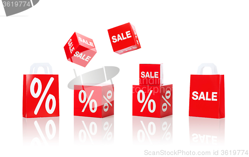 Image of boxes and shopping bags with sale and percent sign