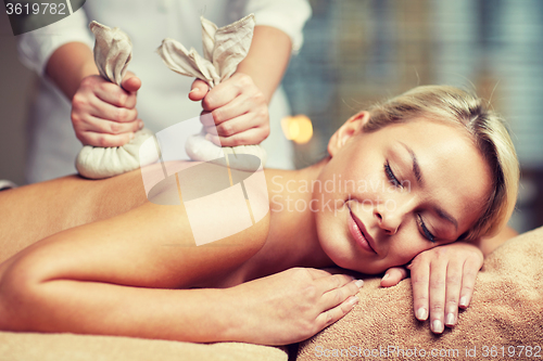 Image of close up of woman lying on massage table in spa