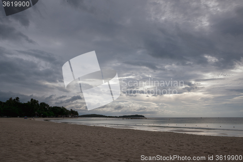 Image of Beach on tropical island. Clear blue water, sand, clouds. 