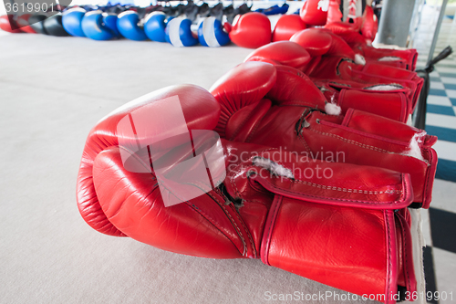 Image of Pairs of red and blue boxing gloves