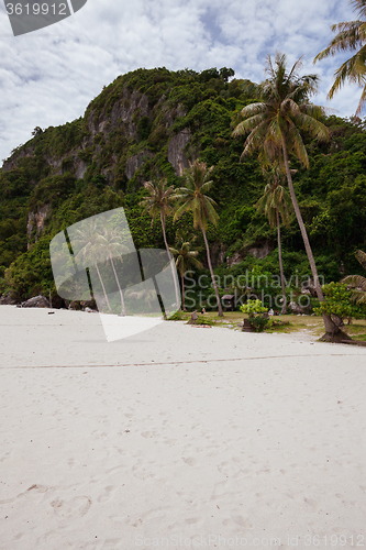 Image of Beach on tropical island. Clear sand, clouds. 