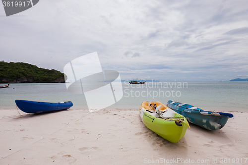 Image of Colorful kayaks on beach in Thailand