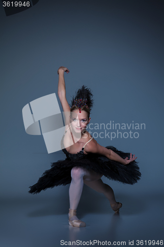 Image of Portrait of the ballerina in ballet tatu on blue background