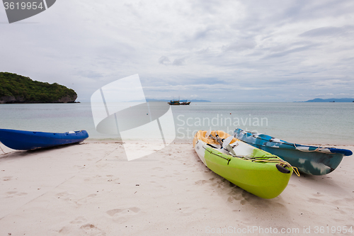 Image of Colorful kayaks on beach in Thailand