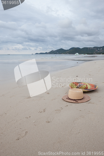 Image of Beach on tropical island. Clear blue water, sand, clouds. 