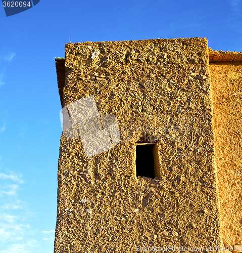 Image of africa  in histoycal maroc  old construction  and the blue cloud