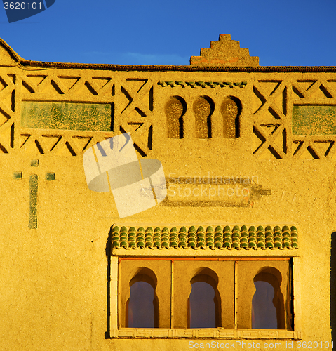 Image of old brown construction in africa morocco and sky  near the tower