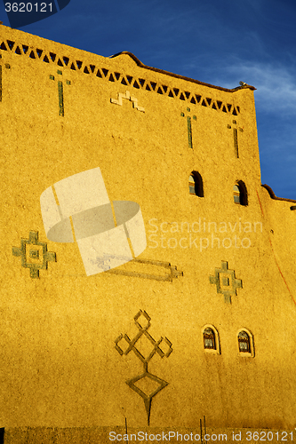 Image of old brown construction in africa morocco   sky  near the tower