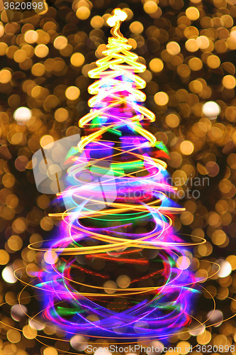 Image of christmas tree with golden background