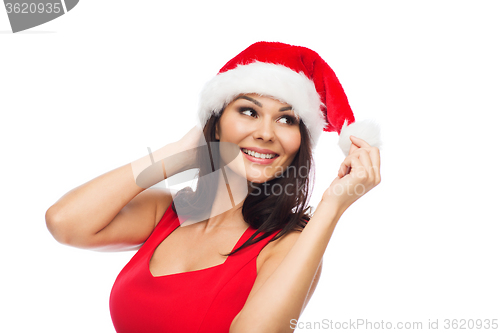 Image of beautiful sexy woman in santa hat and red dress