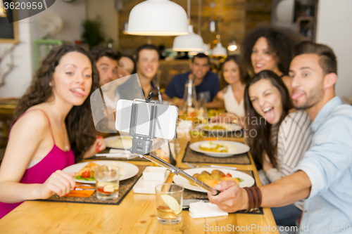 Image of Friends at the restaurant making a selfie