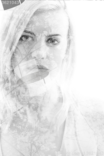 Image of Young girl with leaves in black and white, double exposure