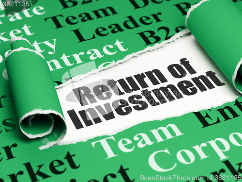 Image of Finance concept: black text Return of Investment under the piece of  torn paper