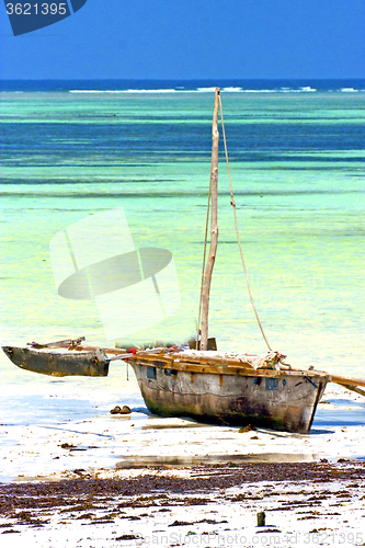 Image of zanzibar beach  seaweed    sand isle  sky and boat