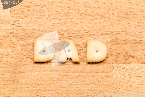 Image of Word Dad biscuit over the wooden background