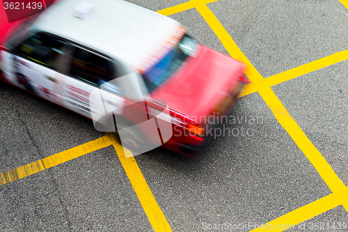 Image of Motion blurred Taxis in Hong Kong.