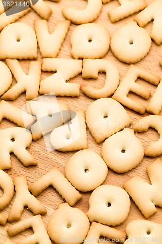 Image of Letter Biscuit over the wooden table