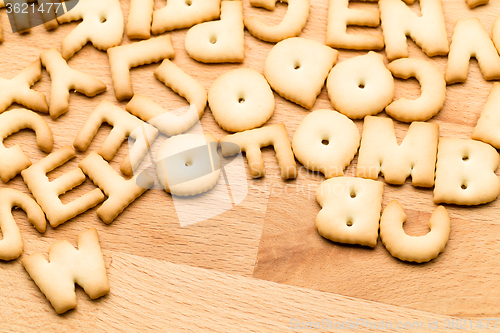 Image of Alphabet cookie over the wooden table