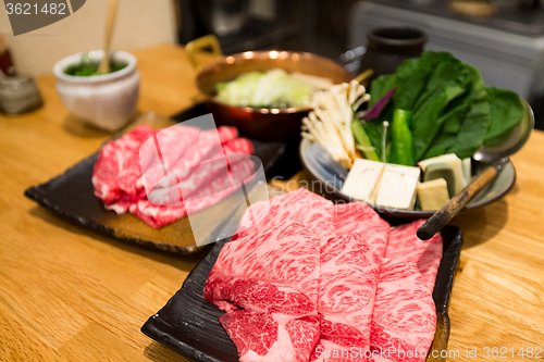 Image of Fresh Beef, pork slices and seafood for Sukiyaki
