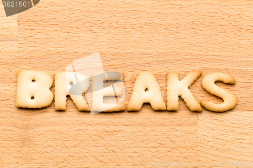 Image of Word break biscuit over the wooden background