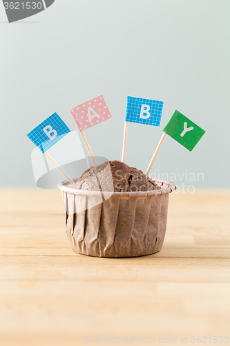 Image of Chocolate muffins with small flag of a word baby