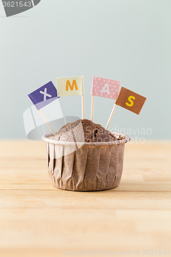 Image of Chocolate muffins with small flag of a x mas