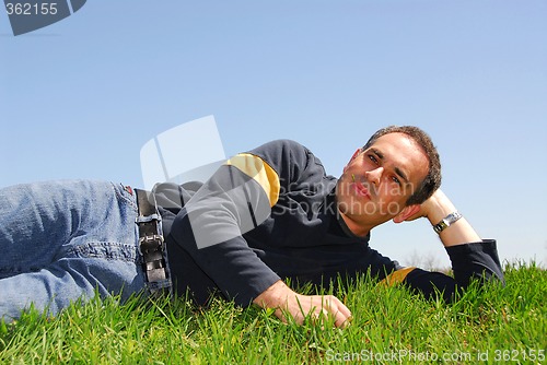 Image of Man lying on grass