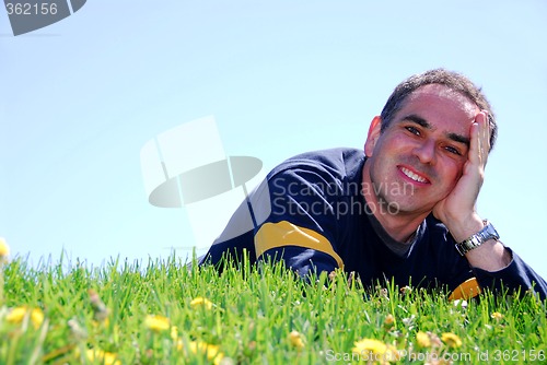 Image of Smiling man on grass