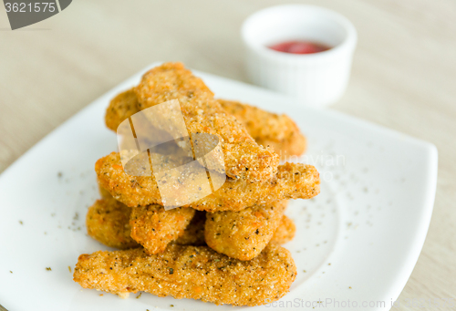 Image of Fresh fried chicken on a white plate 