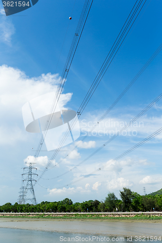 Image of Electrical transmission tower at day time