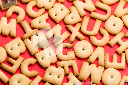 Image of Word biscuit over red background