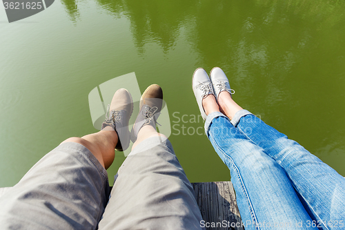 Image of Couple legs wite lake