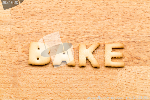 Image of Word bake cookie over the wooden background