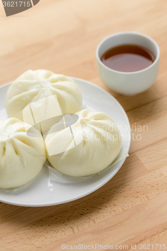 Image of Chinese steamed buns on wood background