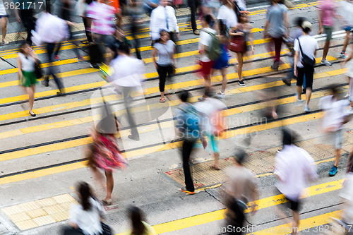 Image of Motion blurred pedestrians crossing Hong Kong street 