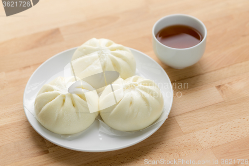 Image of Chinese tea time, bun and tea