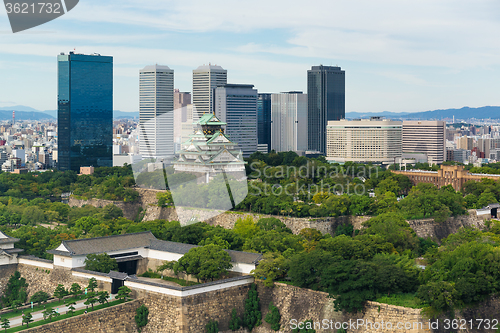 Image of Osaka castle with business building