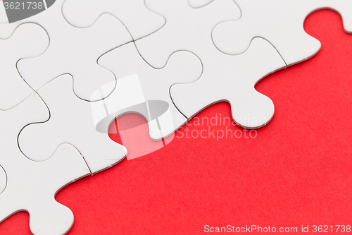 Image of Puzzle over red background