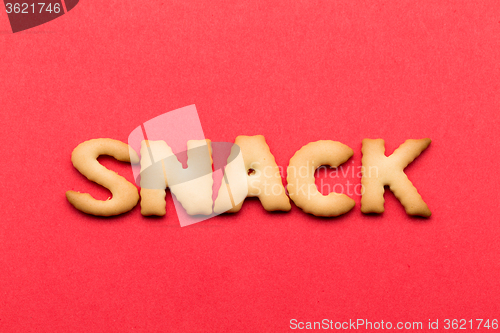 Image of Word snack cookie over the red background
