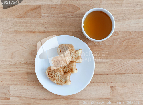 Image of Taiyaki, japanese fish shape cake with tea