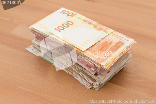 Image of Stack of Hong Kong dollar on the table