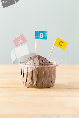 Image of Chocolate muffins with small flag of word ABC