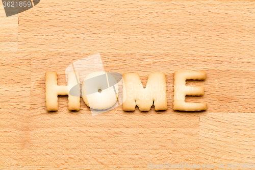 Image of Word home cookie over the wooden background