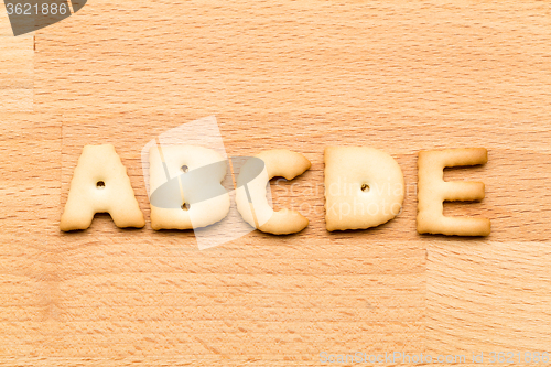 Image of Letter ABCDE cookie over the wooden background