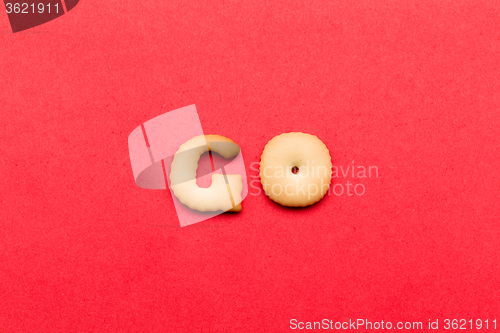 Image of Word Go cookie over the red background