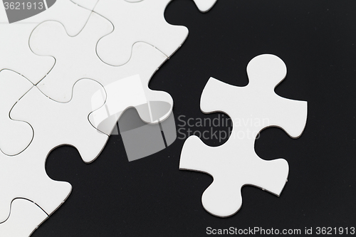Image of Jigsaw pieces isolated on black Jigsaw and puzzles concepts