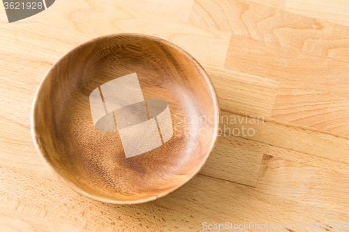 Image of Vintage empty wooden plate on oak table wood