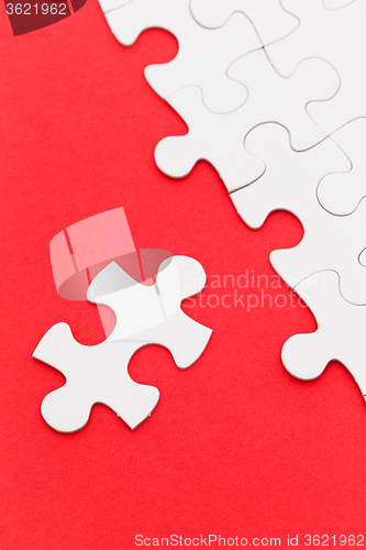 Image of Jigsaw puzzle over the red background